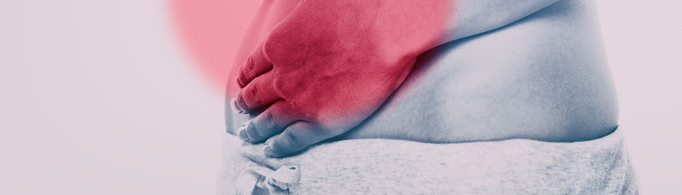 Woman holding stomach